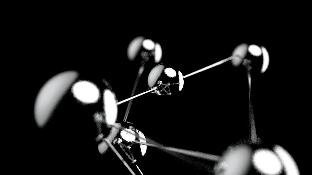 A 3D wallpaper with molecule design and a chrome finish features intricate molecular structures rendered in 3D and given a metallic shine. The result is a visually stunning, high-tech design with a touch of science fiction.